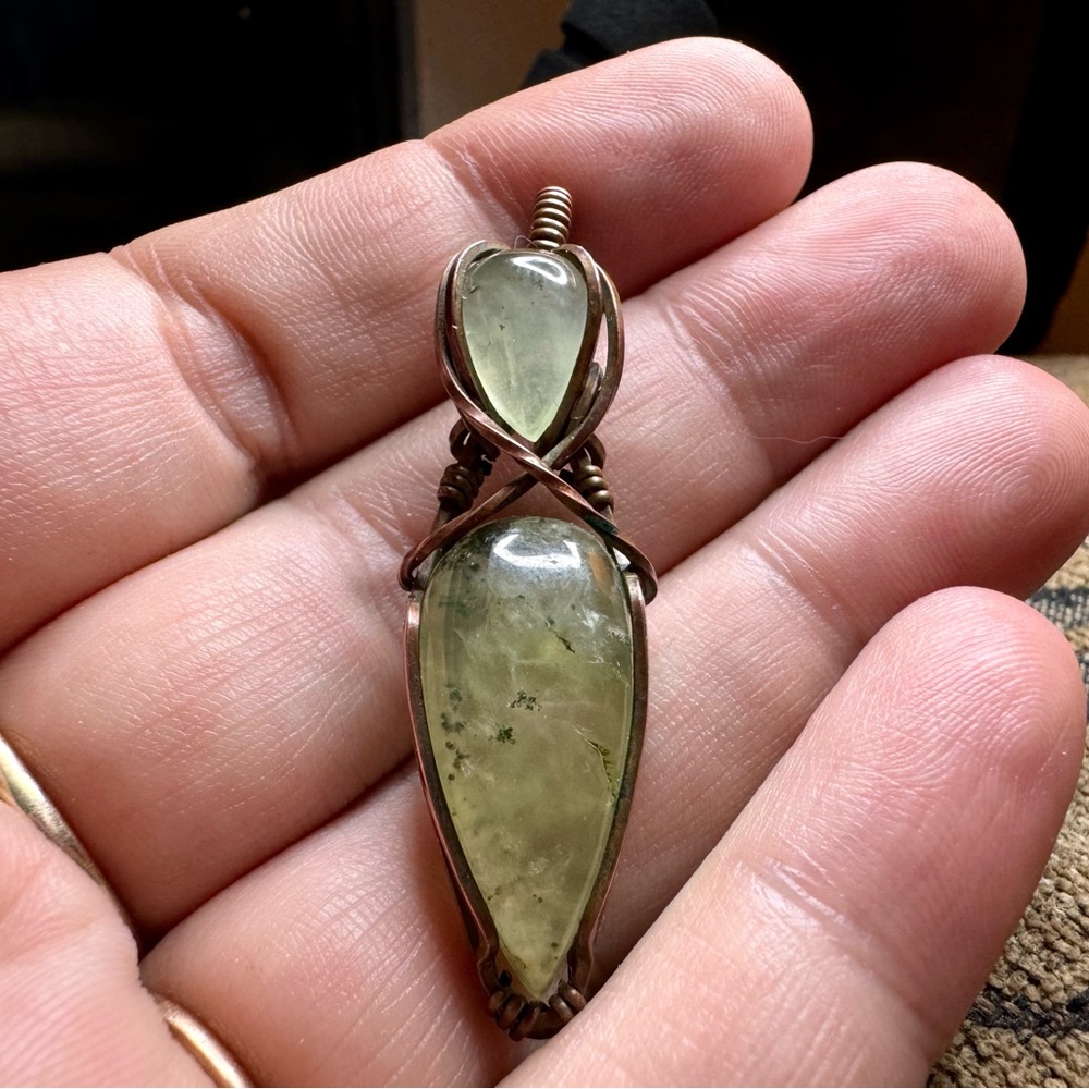 Wire wrapped stones in a pendant.
